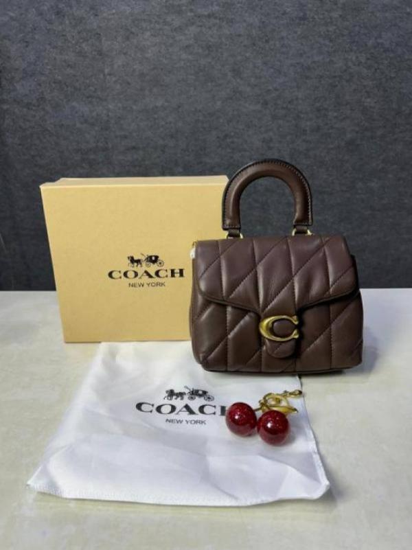 6ace0a9c7e6410.jpg Coac tabby top handle quilted leather with cherry charm with box 882 - Image 1