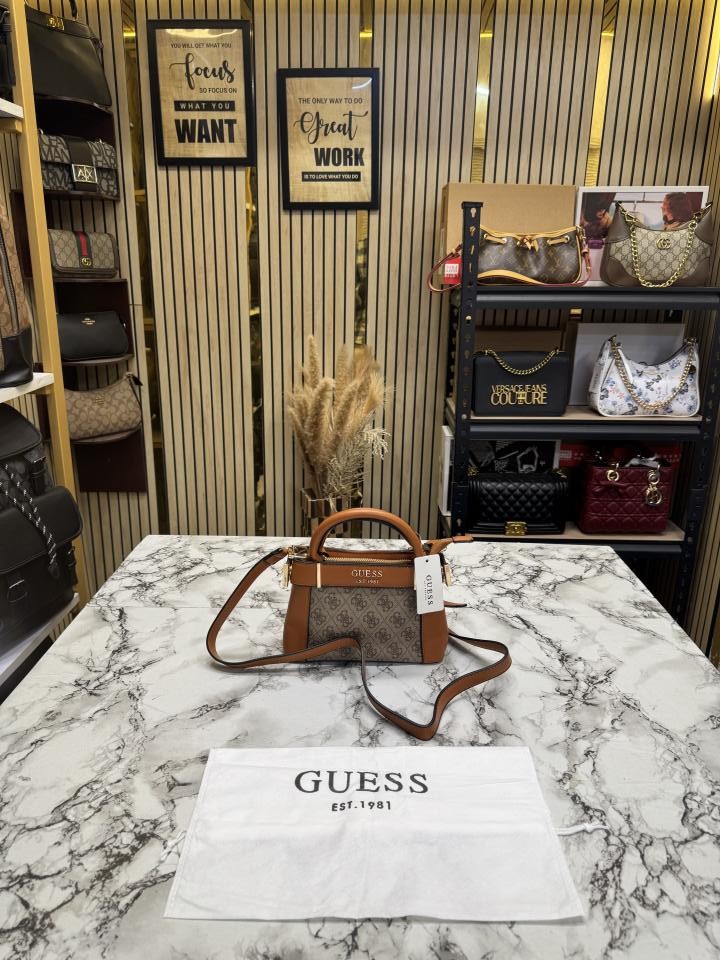 6ace0c91c3f640.jpeg GUESS Brown Signature Mini Satchel Bag With Dust Bag - Image 1